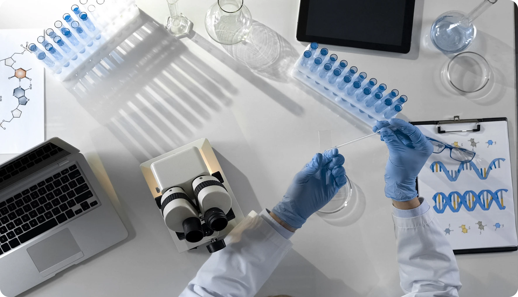 Scientist working in a lab with equipment.